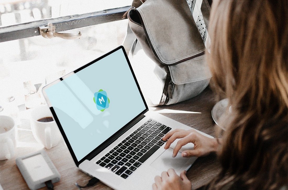 Free Woman Using a MacBook Mockup