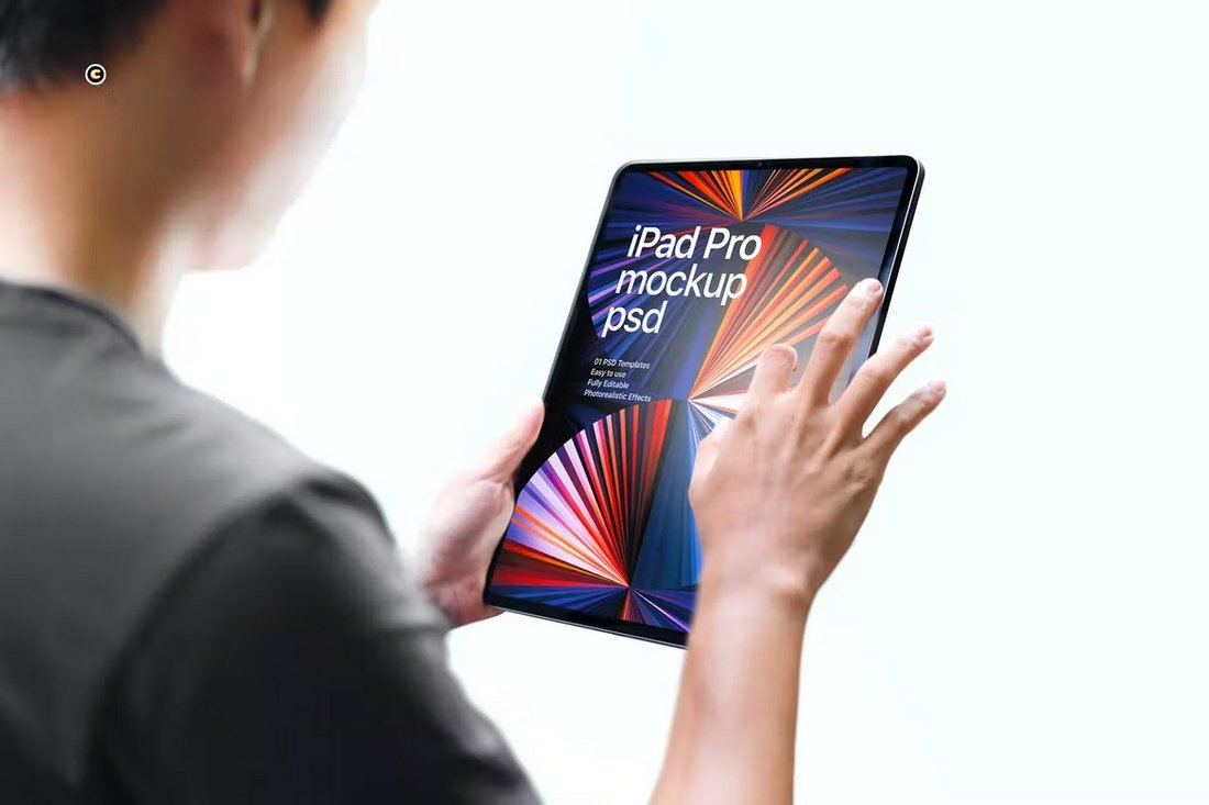 Man Holding iPad Pro Mockup Template